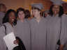 A woman in graduation gown; Actual size=180 pixels wide